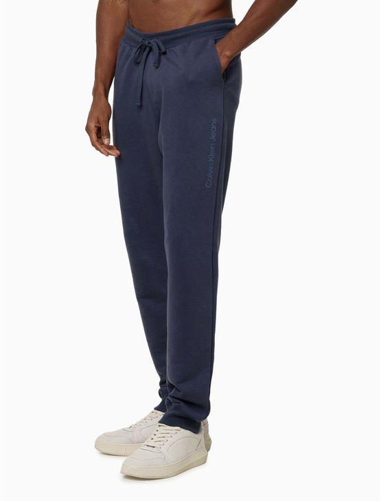 Calça Moletom Masculina Com Bolsos Logo Detalhe Calvin Klein Jeans - Azul Marinho Calça Moletom Masculina Com Bolsos Logo Detalhe Calvin Klein Jeans Azul Marinho m